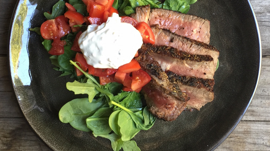 Char Grilled Steak with Tomatoes and Creamy Garlic Sauce